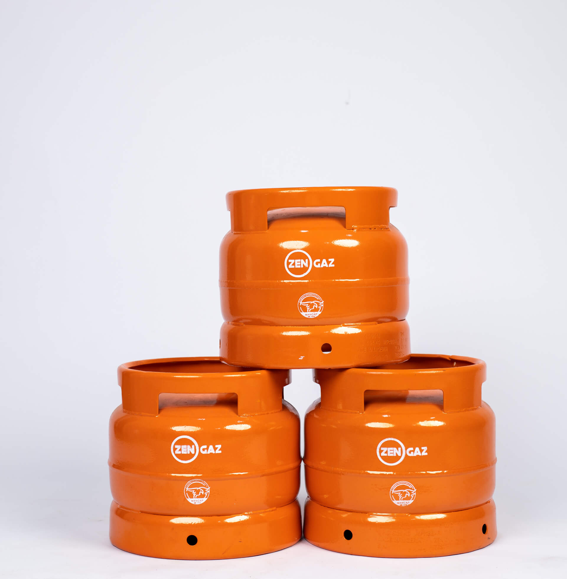 LPG cylinders with ventilation holes at the bottom, manufactured by Zen Limited, a leading LPG cylinder manufacturer in Nigeria.